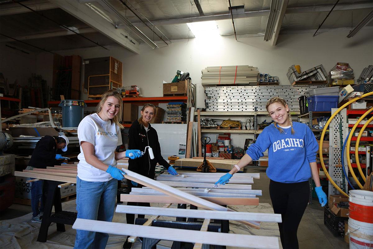 Three students volunteering